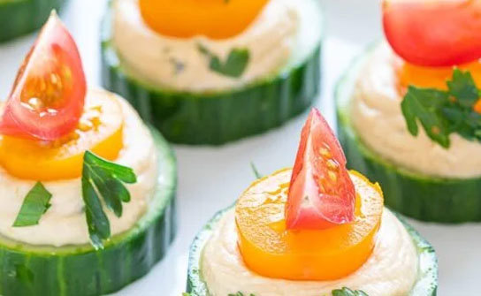 These vegan cucumber hummus bites are an easy summer appetizer that’s perfect for bbqs. - from RobbenFoods